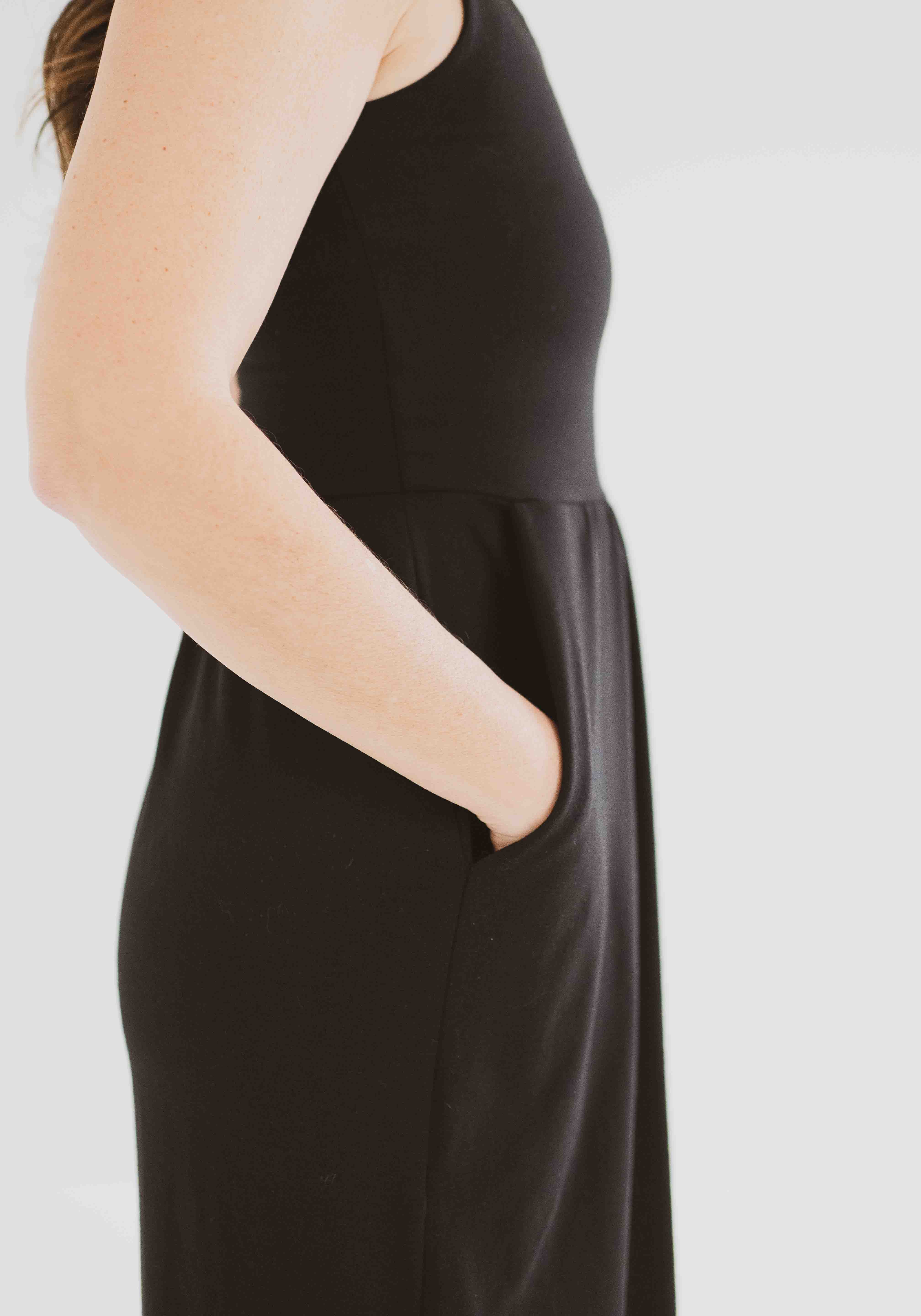 side view of black square neck tank dress with pockets clothing made in canada