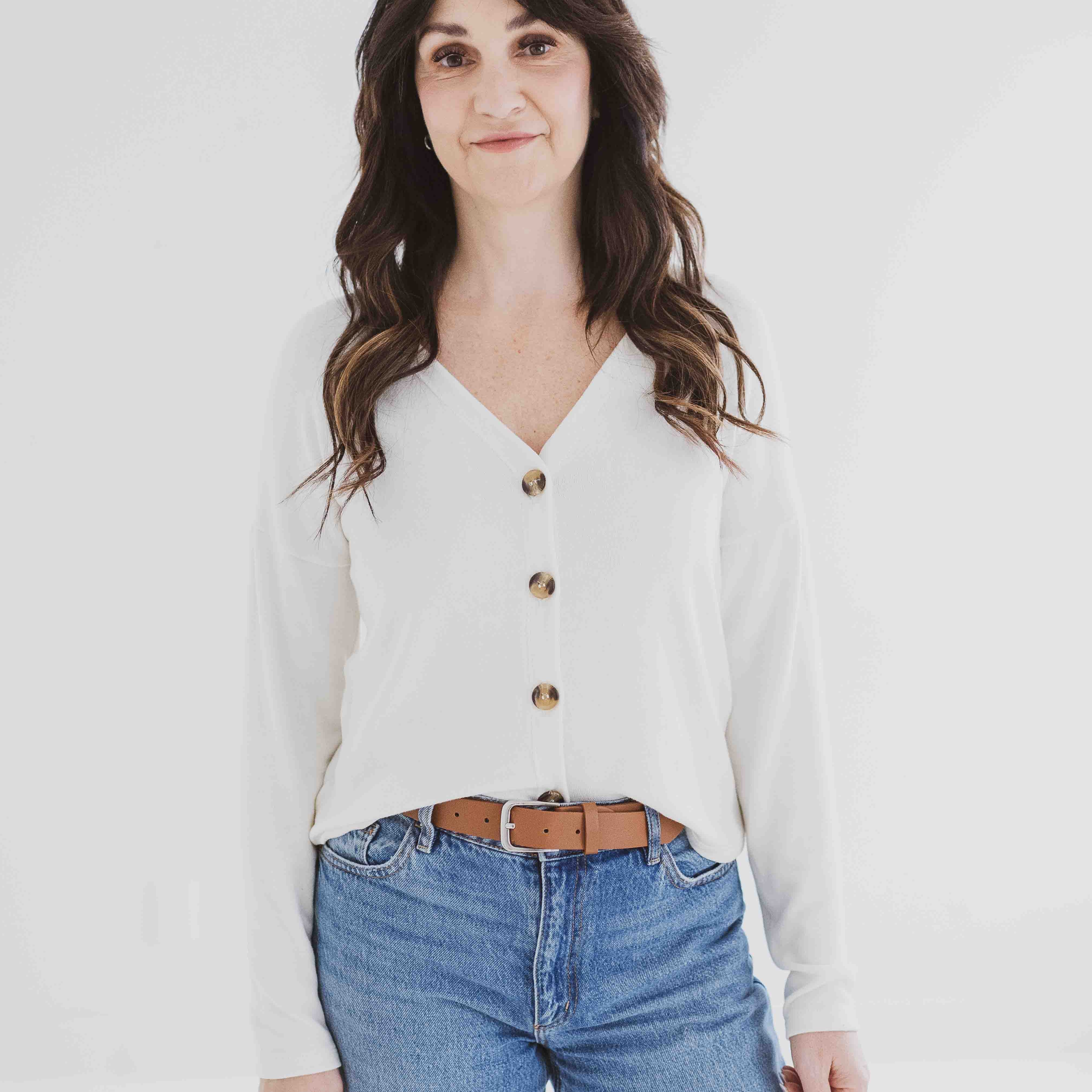 Front view of button up cream cardigan made in canada