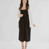 carolina cardigan in cream worn over black tank dress made in canada