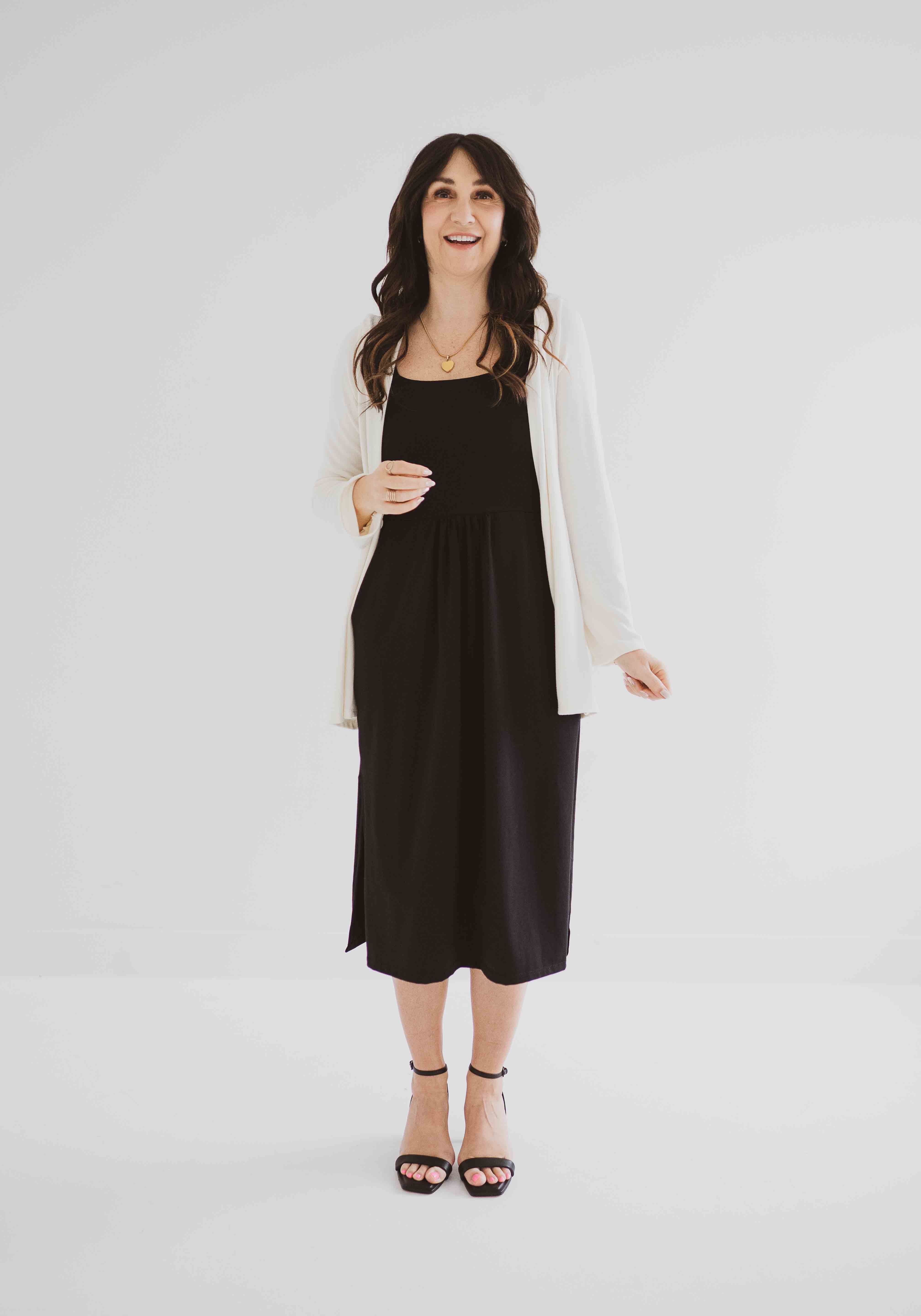 carolina cardigan in cream worn over black tank dress made in canada