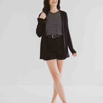 made in Canada cardigan for women with black and white striped t-shirt and black shorts