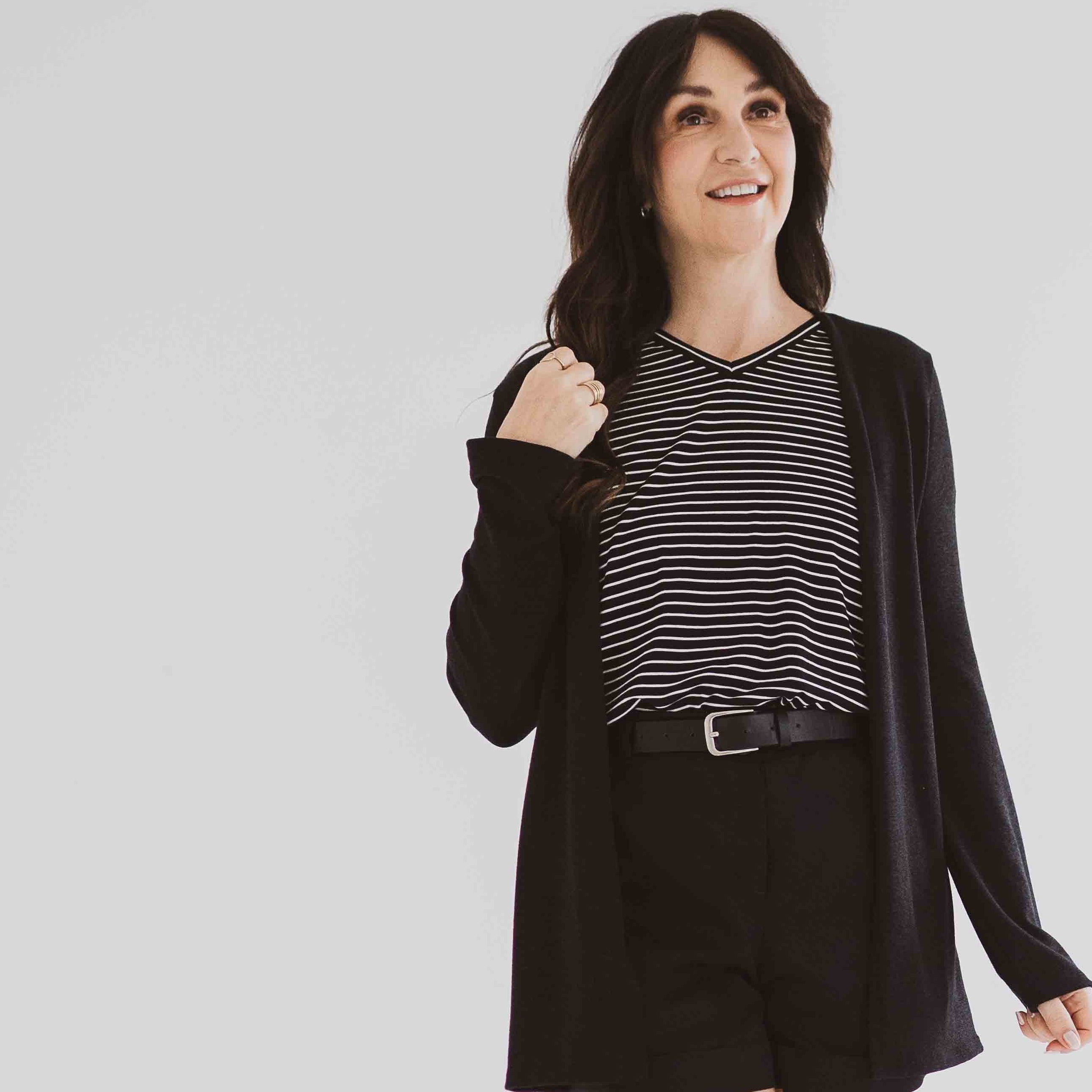 made in Canada cardigan for women with black and white striped t-shirt and black shorts