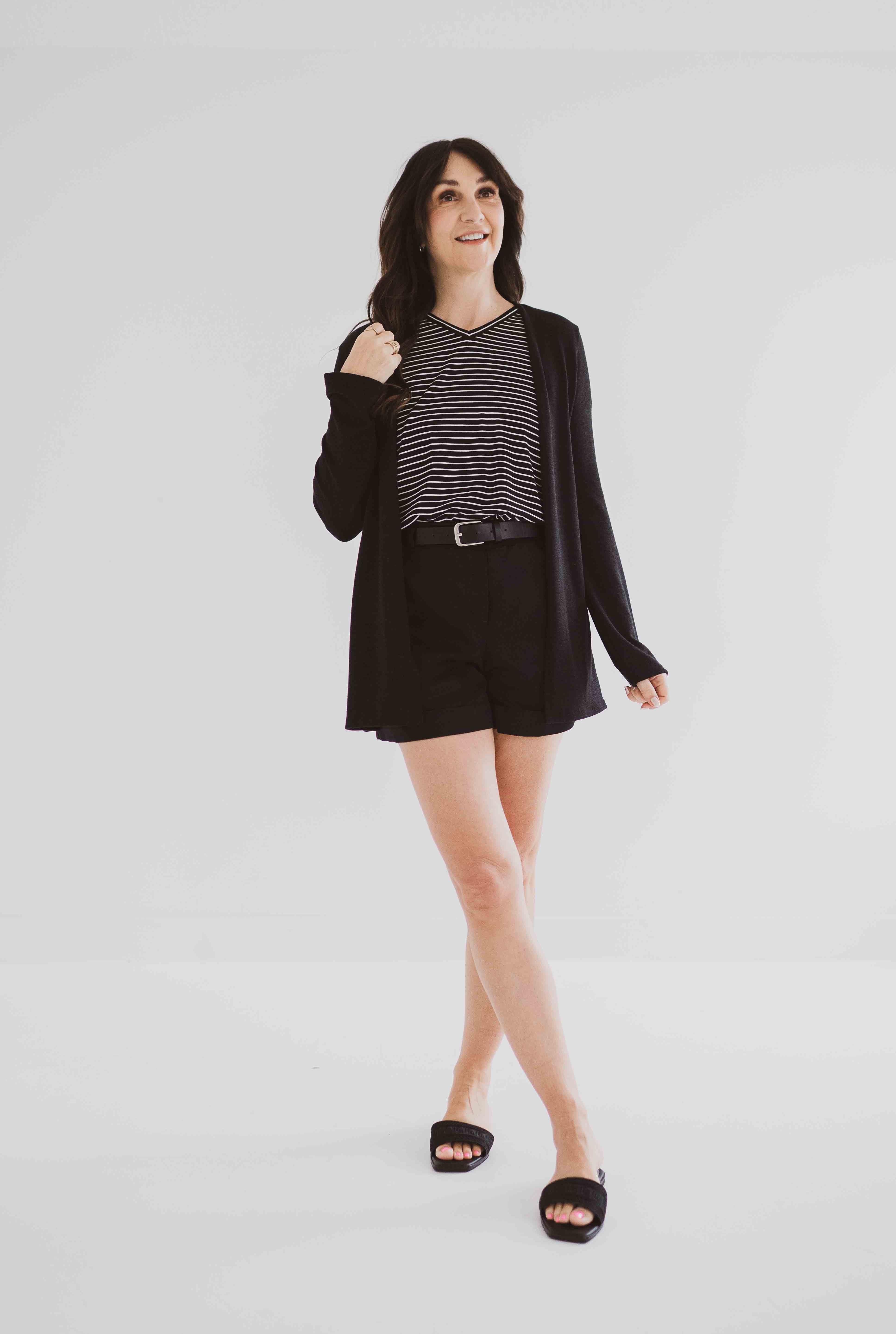 made in Canada cardigan for women with black and white striped t-shirt and black shorts