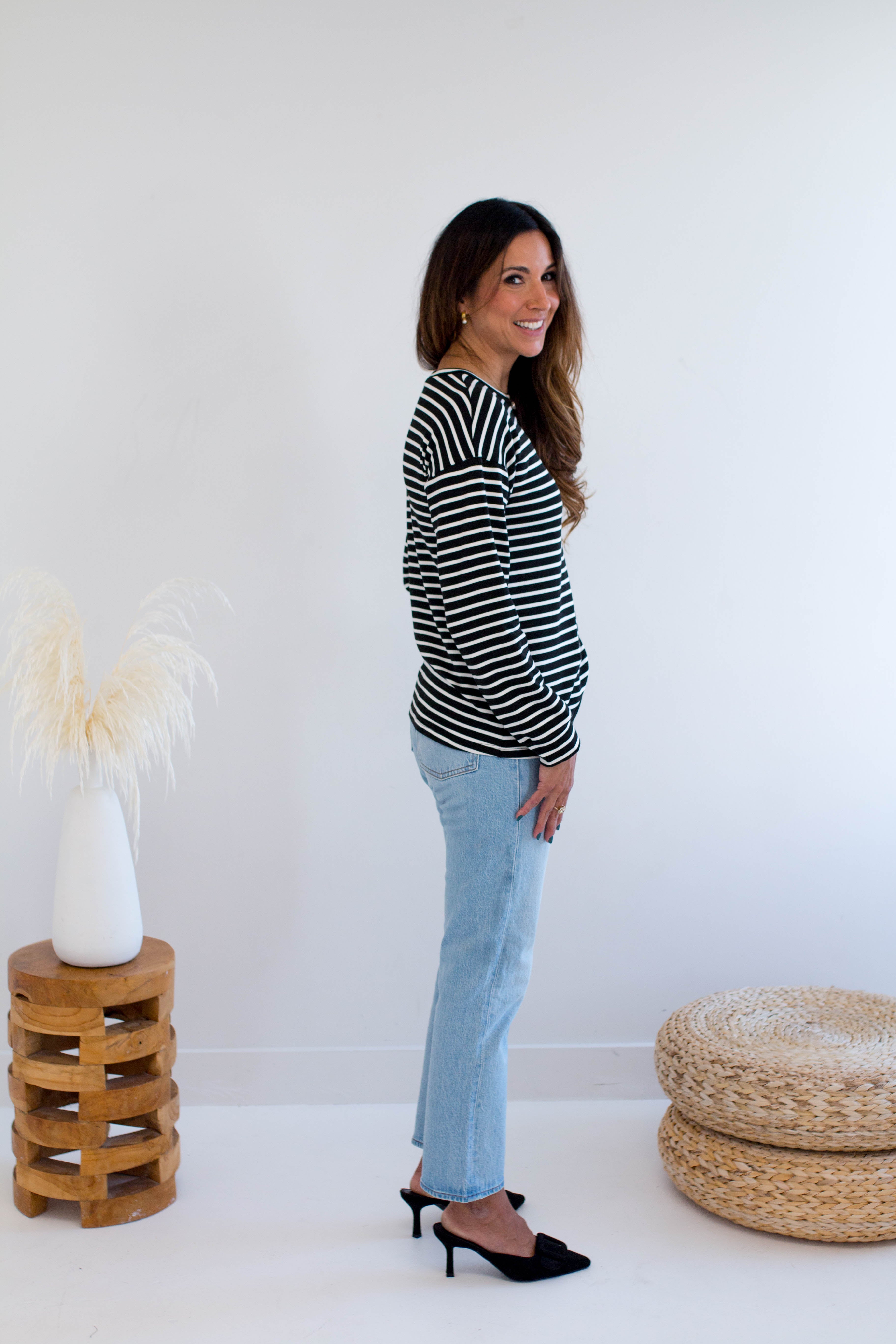 Black and white striped sweatshirt made in Canada side view