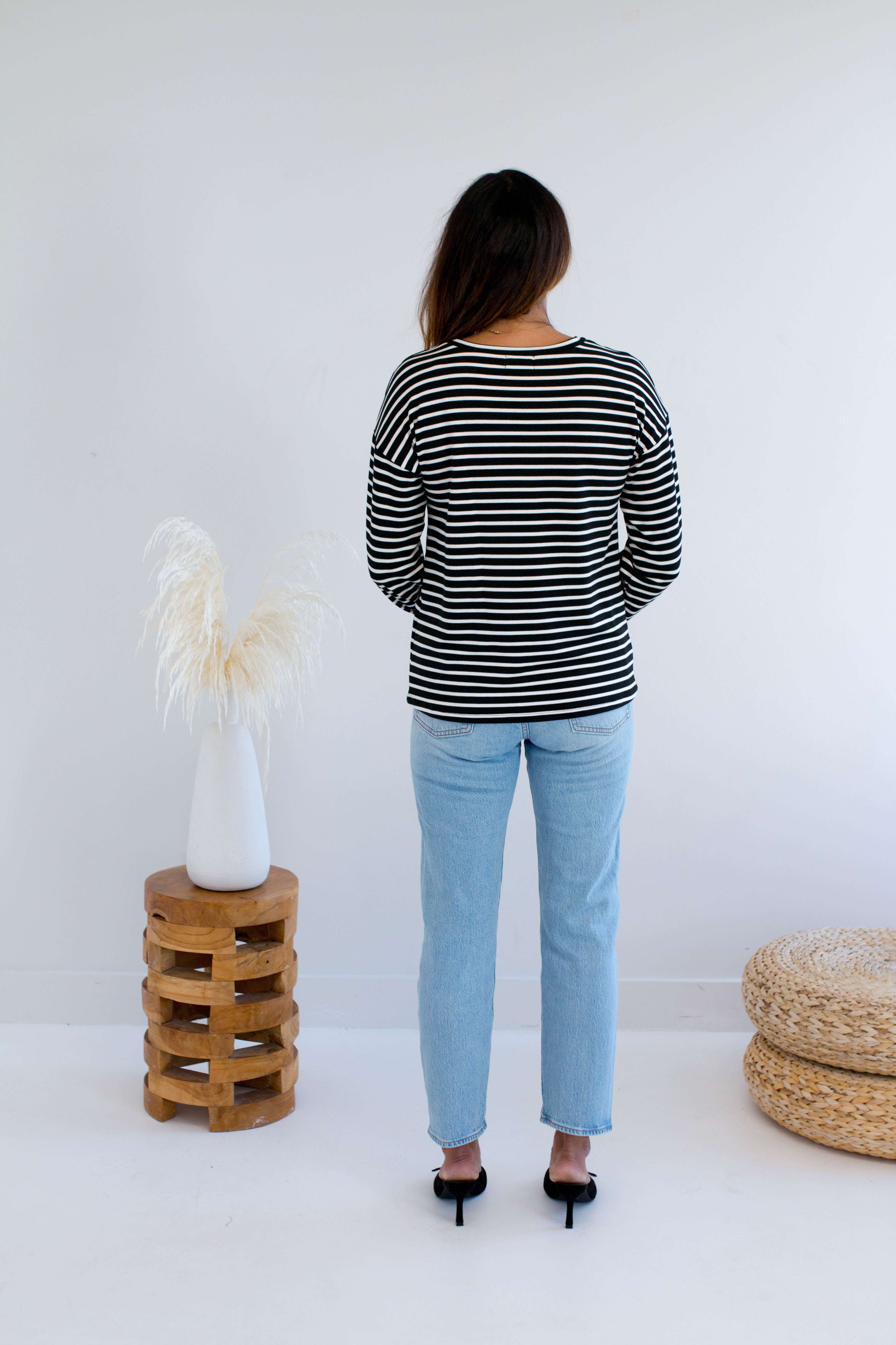 Back view of Black and white striped sweatshirt made in Canada 