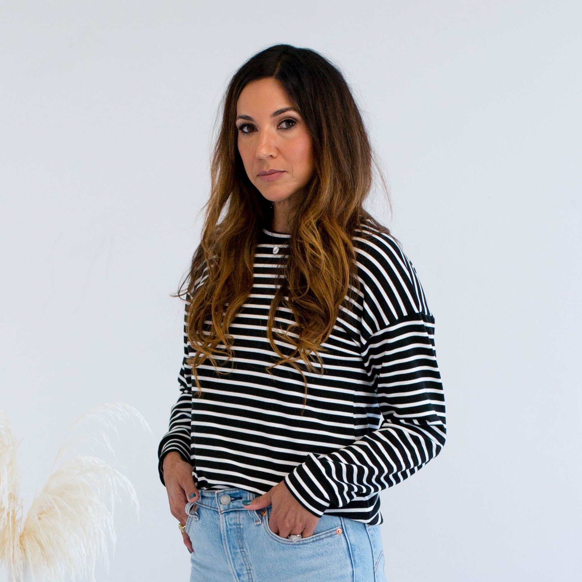Black and white striped sweater with jeans made in Canada 