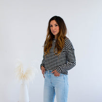 Black and white striped sweater with jeans made in Canada 