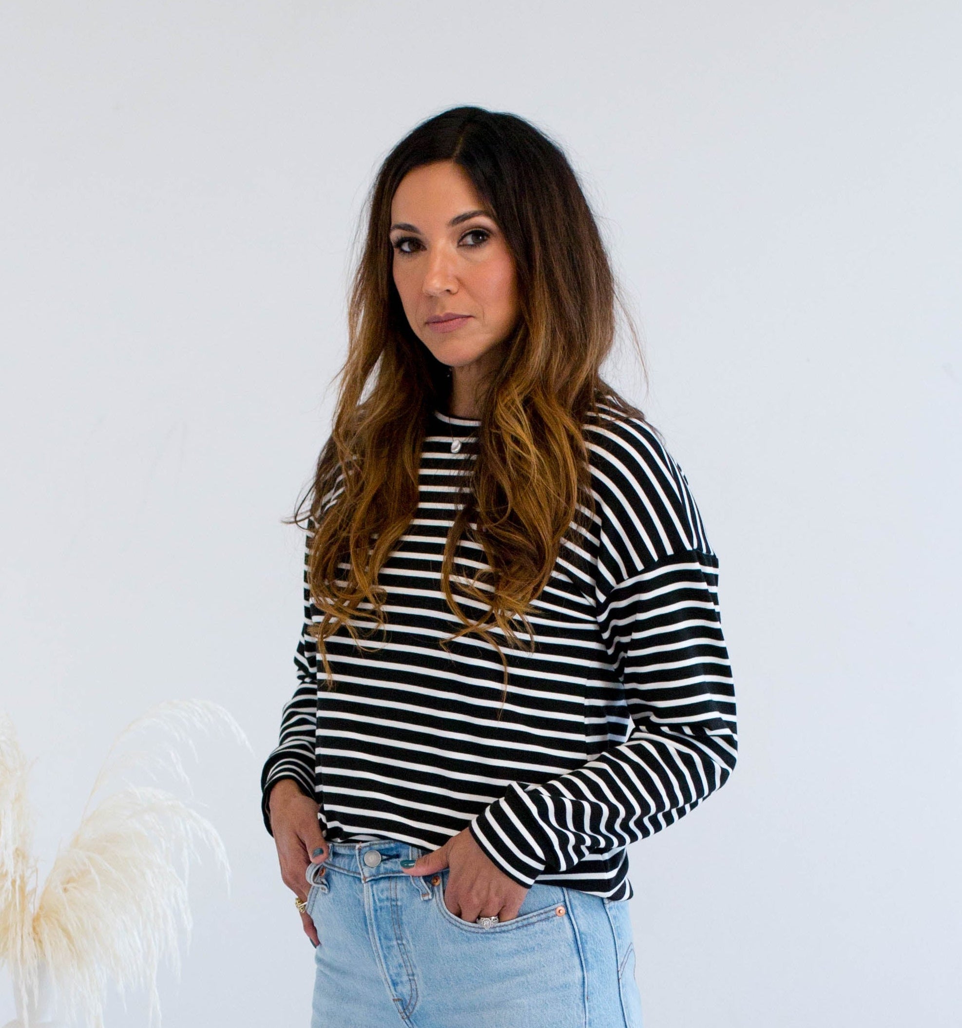 Black and white striped sweater with jeans made in Canada 