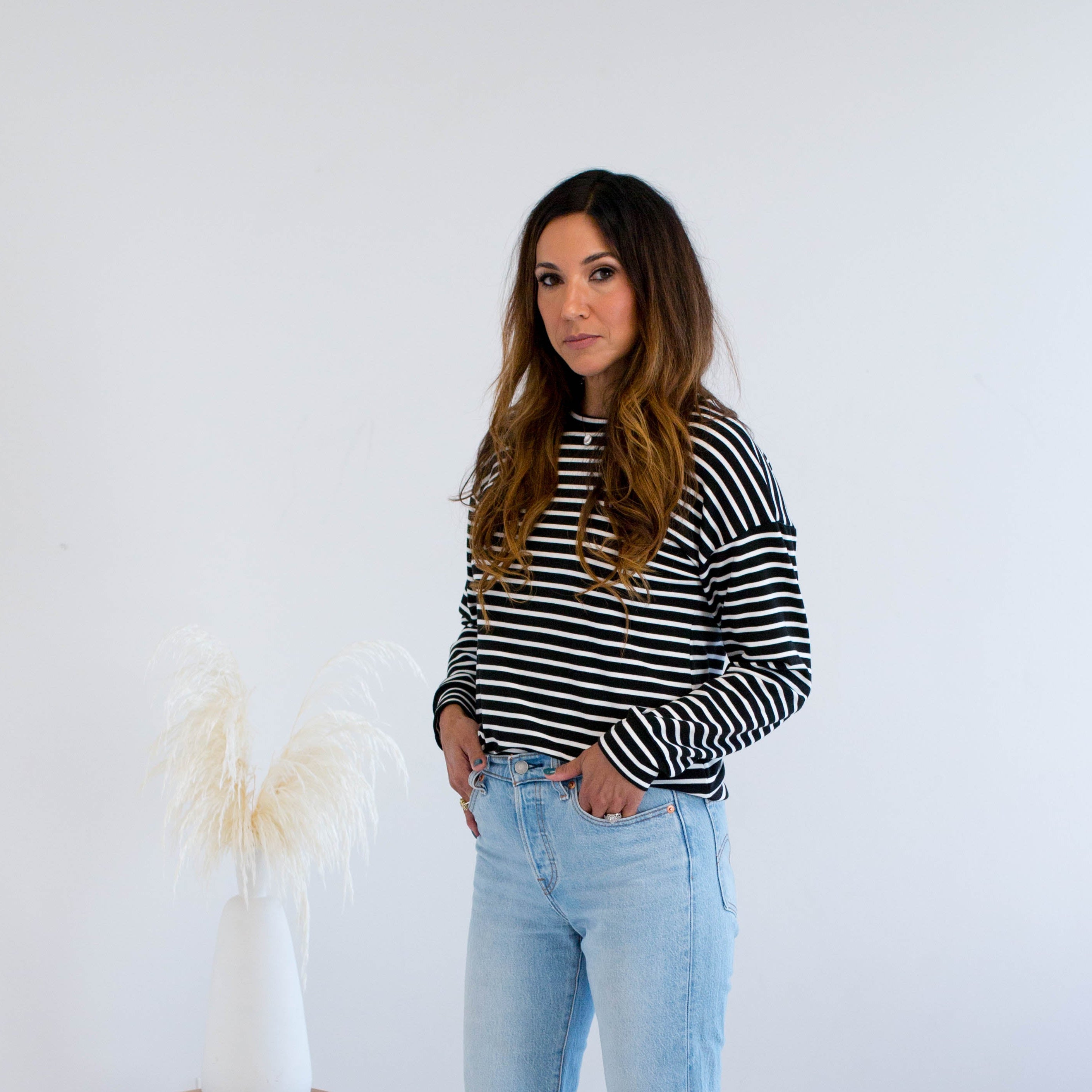 Black and white striped sweater with jeans made in Canada 