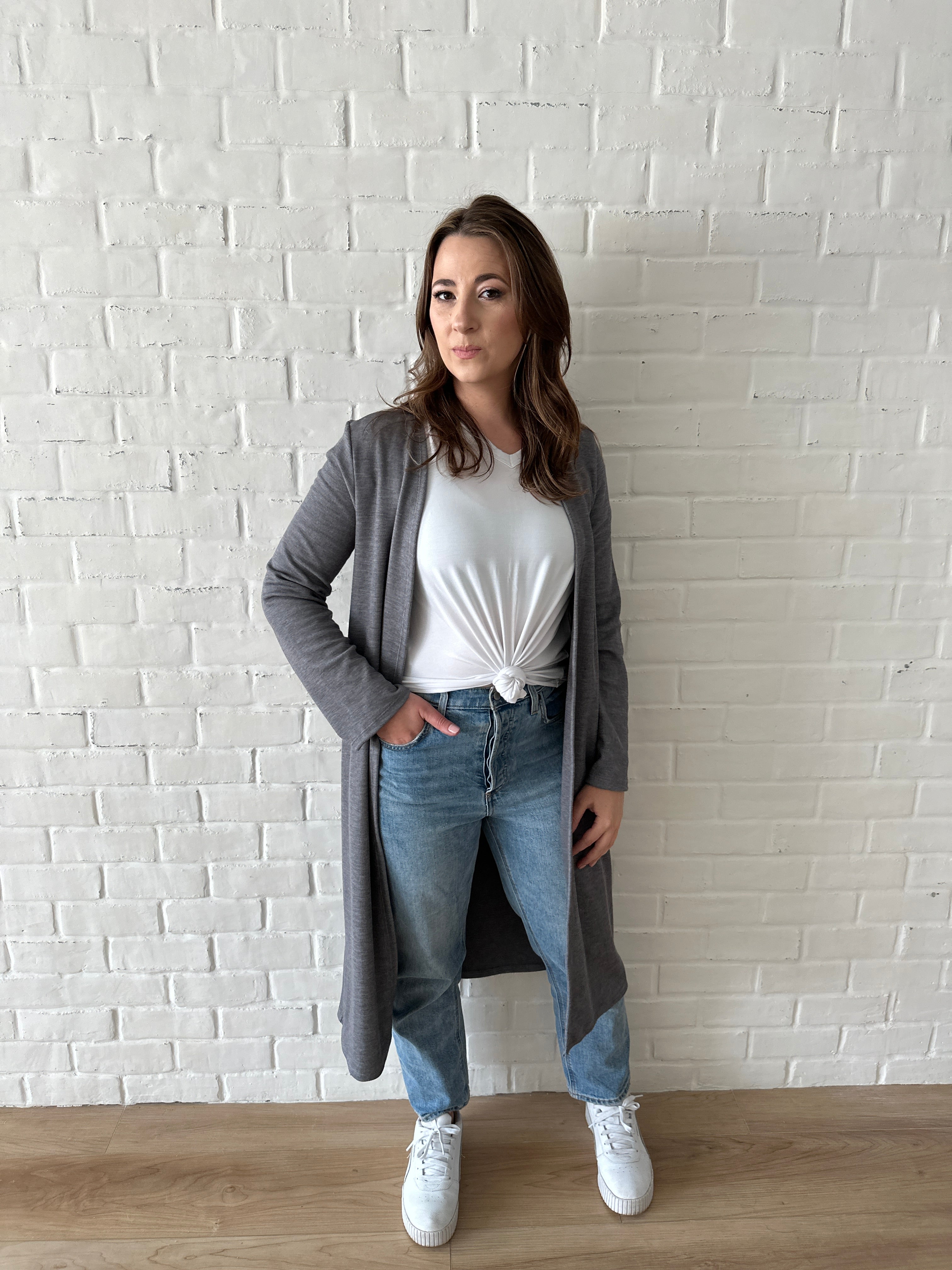 woman wearing long grey cardigan and white t-shirt