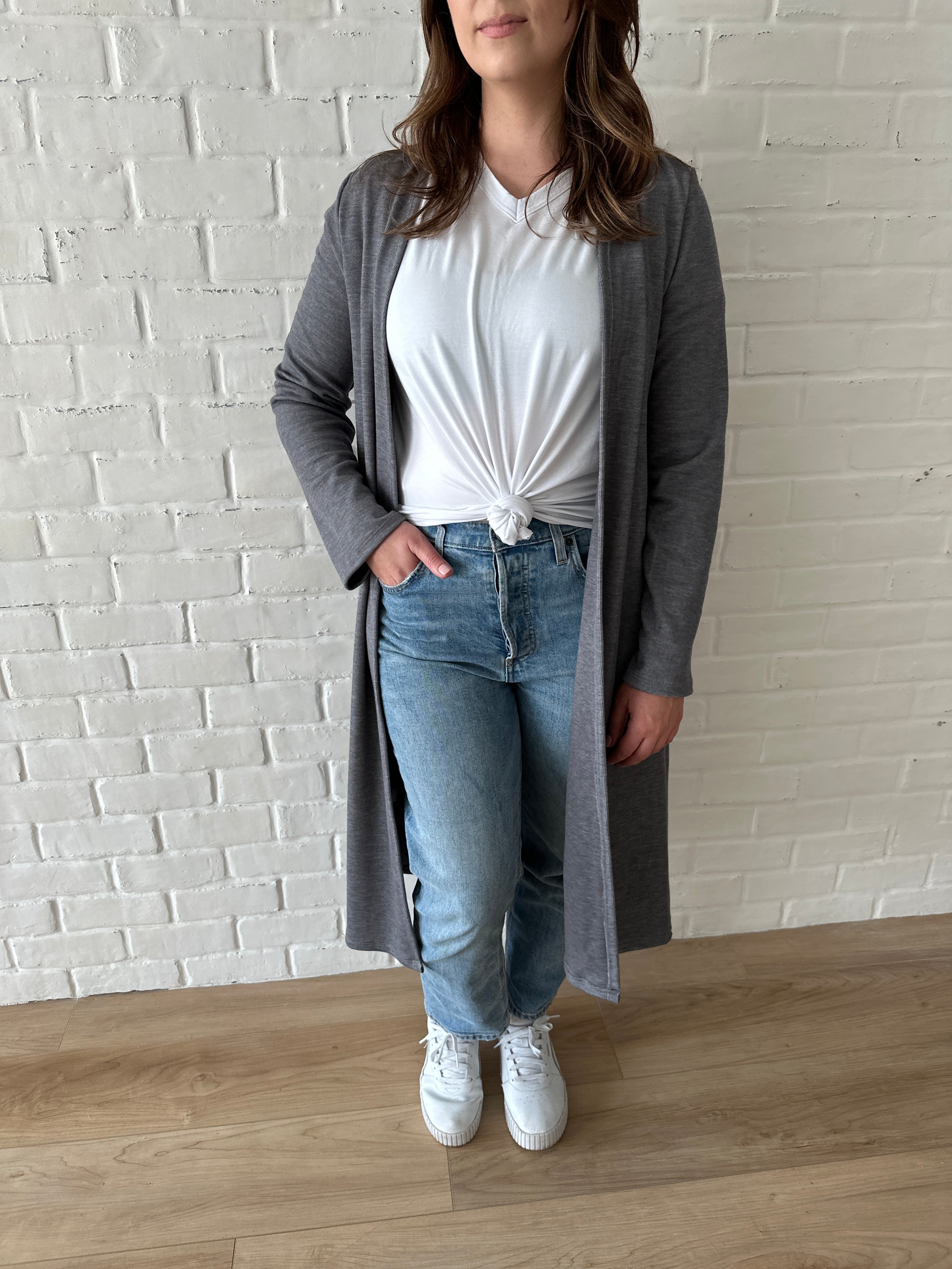 woman wearing long grey cardigan and white t-shirt