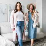 two women wearing long pink cardigan and white v-neck t-shirt and the other wearing a blue tank dress