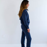 Side View. Ang Hill woman wearing navy blue bamboo loungewear set. Made in Canada