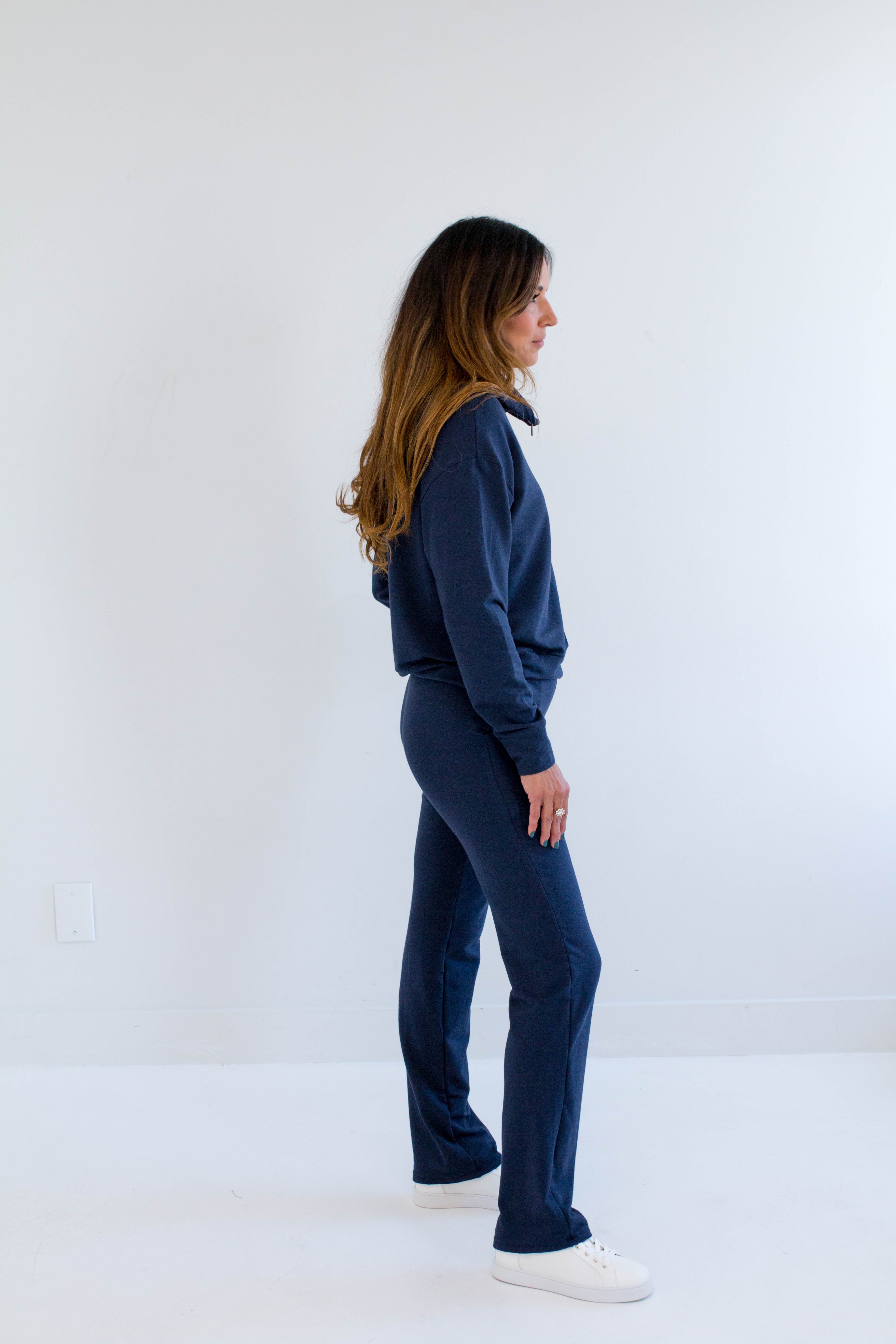 Side View. Ang Hill woman wearing navy blue bamboo loungewear set. Made in Canada