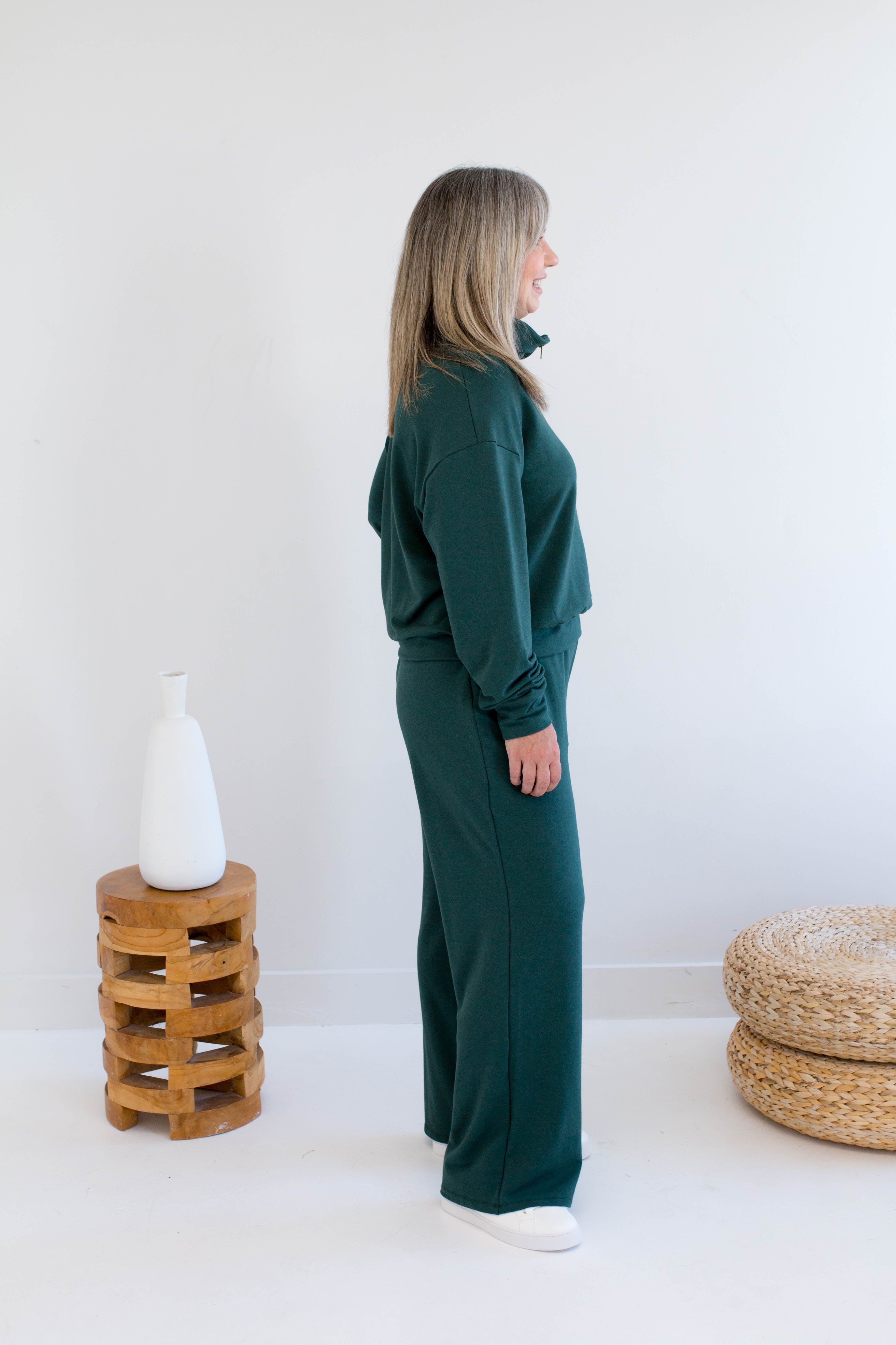 Side view. Ang Hill woman wearing green bamboo loungewear set. Made in Canada