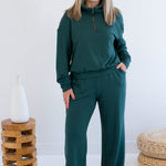 Ang Hill woman wearing green bamboo loungewear set. Made in Canada