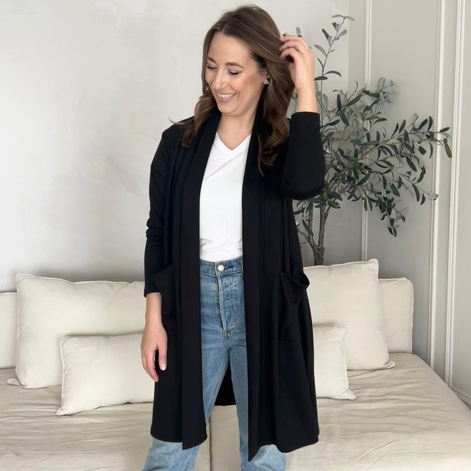 black cardigan with pockets and white v-neck t-shirt