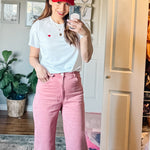 Model wearing Made in Canada with Love Heart T-shirt Ang Hill with pink pants and red cap