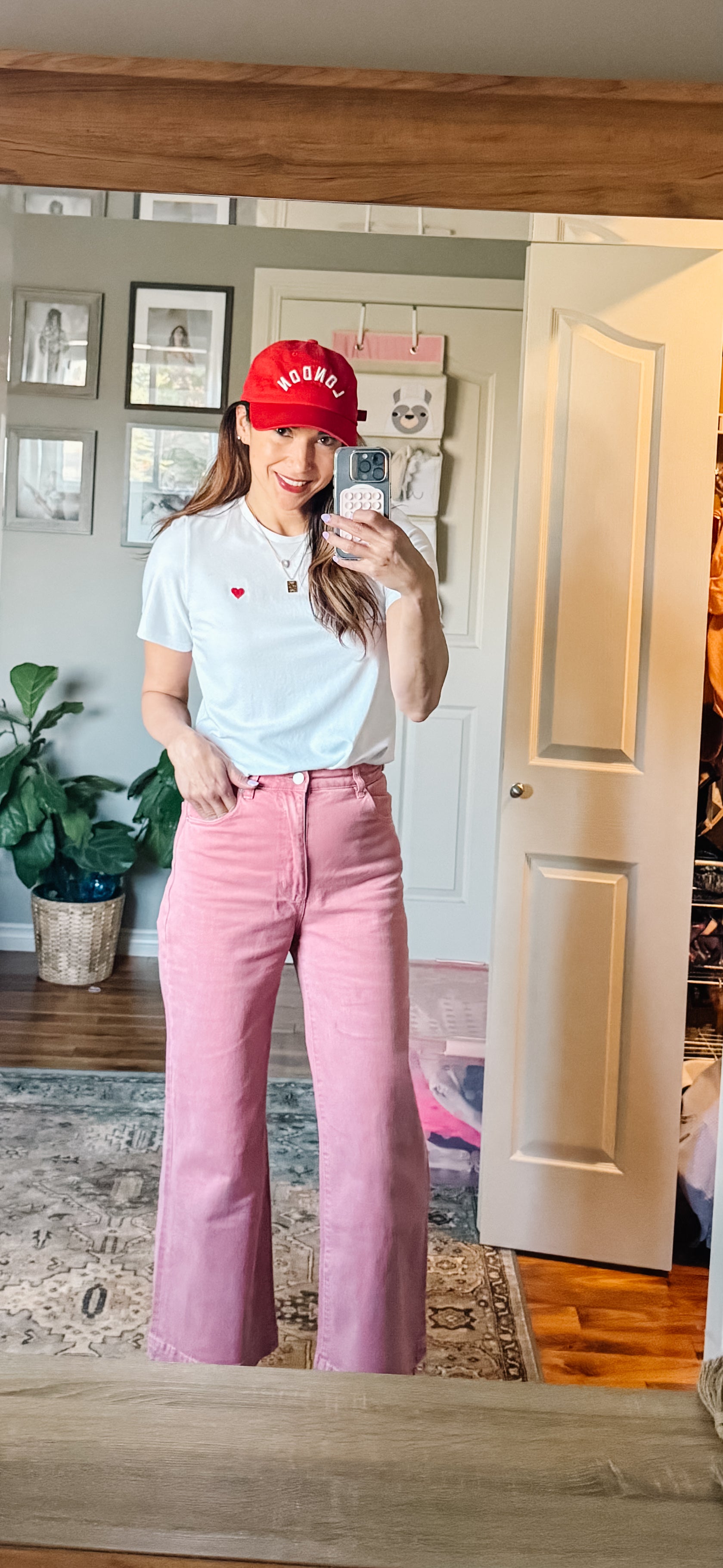 Model wearing Made in Canada with Love Heart T-shirt Ang Hill with pink pants and red cap