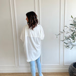 back view of white button up shirt