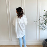 back view of white button up shirt