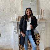 woman wearing white t-shirt and and black long cardigan