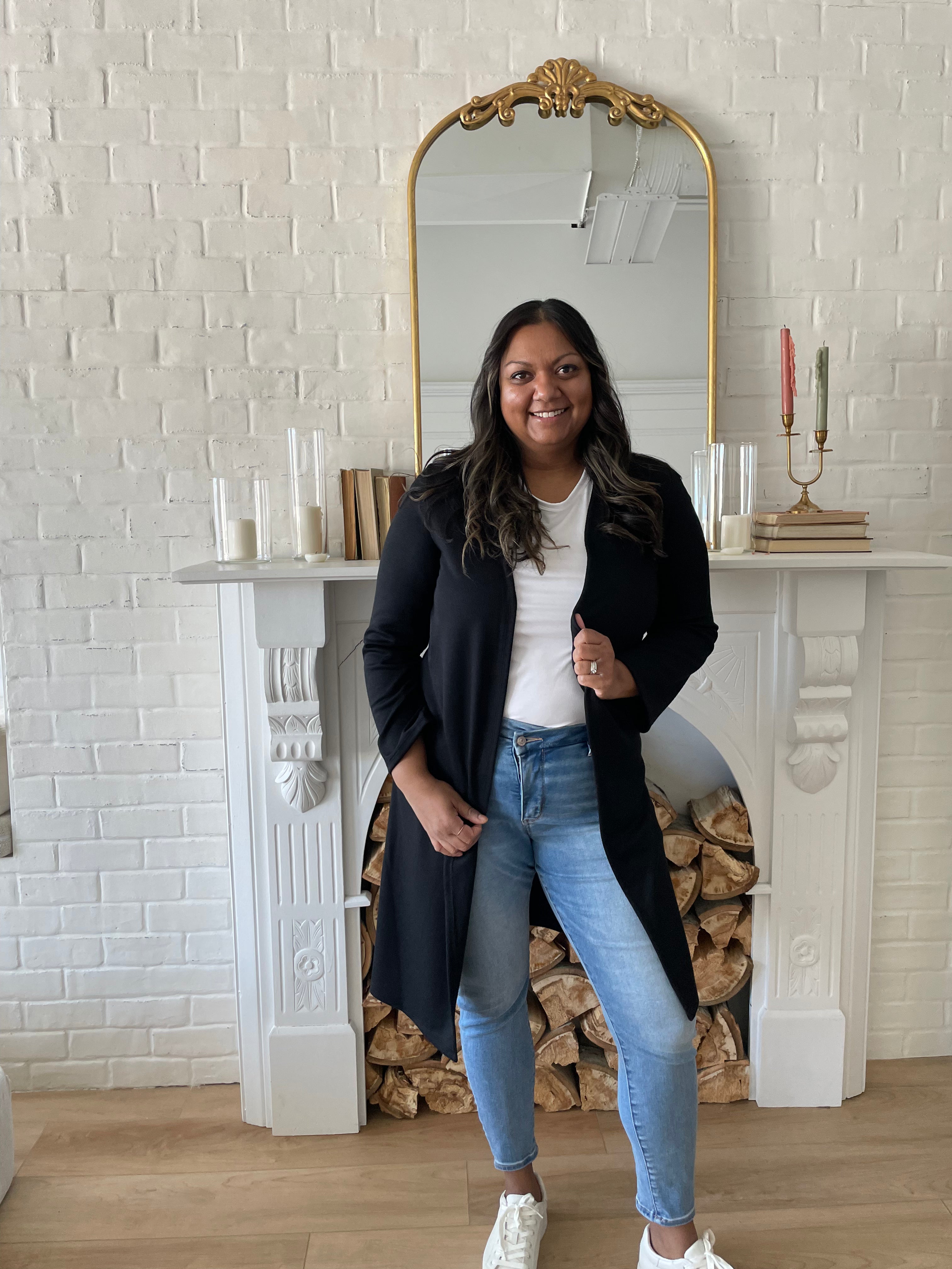 woman wearing white t-shirt and and black long cardigan