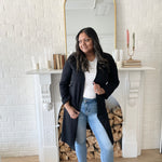 woman wearing white t-shirt and and black long cardigan