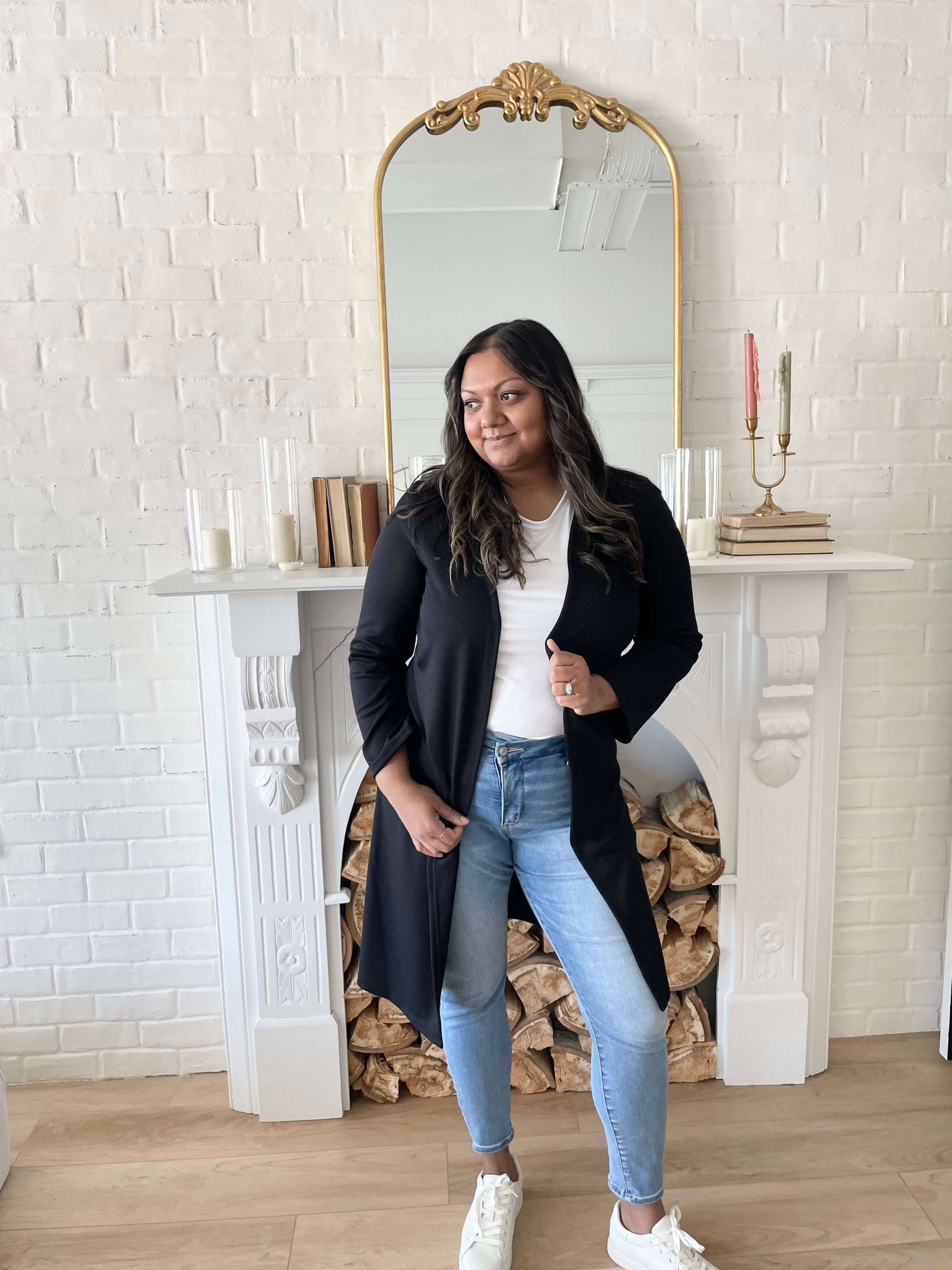 woman wearing white t-shirt and and black long cardigan