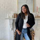 woman wearing white t-shirt and and black long cardigan