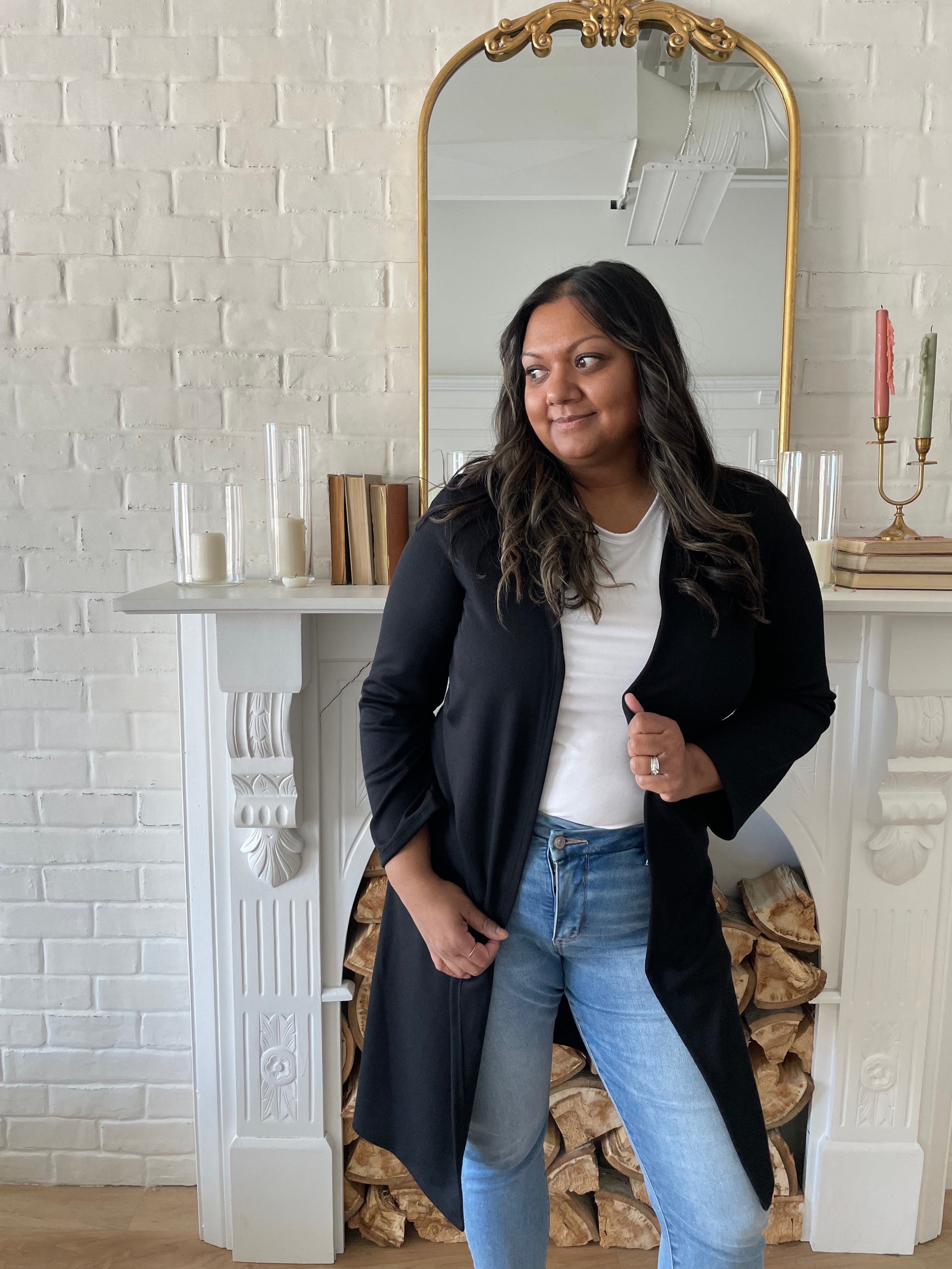 woman wearing white t-shirt and and black long cardigan