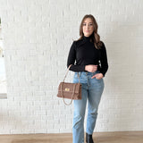 black turtleneck and jeans