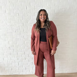 woman wearing a brown cardigan and brown wide legged pants