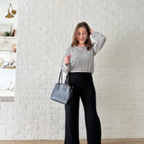 black and white striped top and wide leg pants