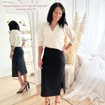 Woman wearing a black ribbed knit midi skirt apparel made in canada