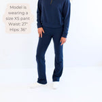 Ang Hill woman wearing navy bamboo wide leg loungewear pants. Made in Canada with measurements