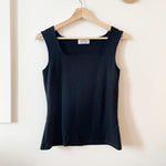 black square neck top hanging on hanger