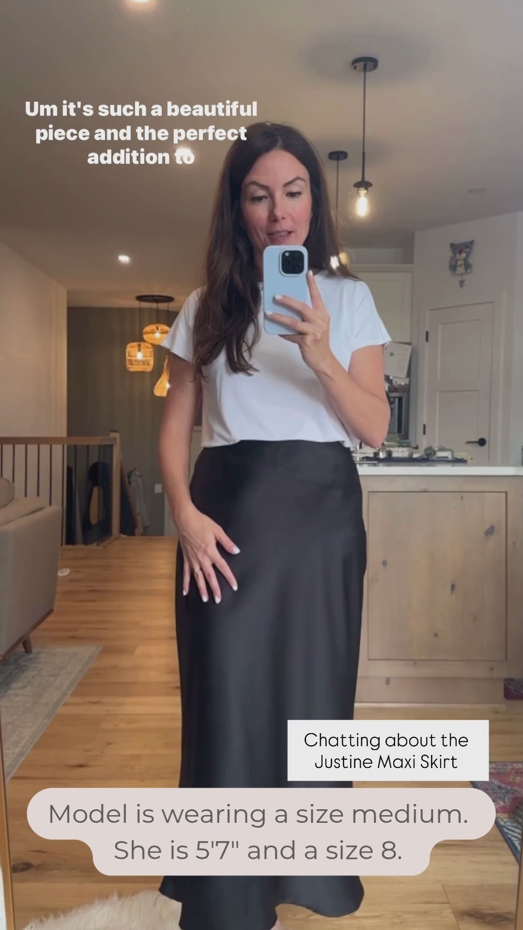 Woman wearing a white t-shirt and black satin maxi skirt video. Made in Canada