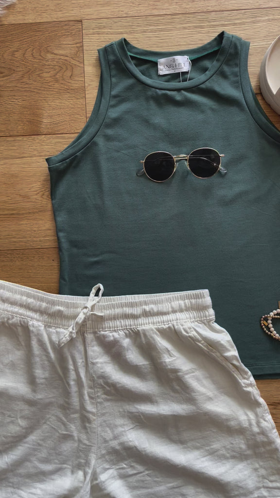video of teal green high neck tank top for women outfit