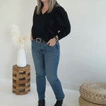 Video of woman wearing a black v-neck sweater. Bamboo clothing made in canada