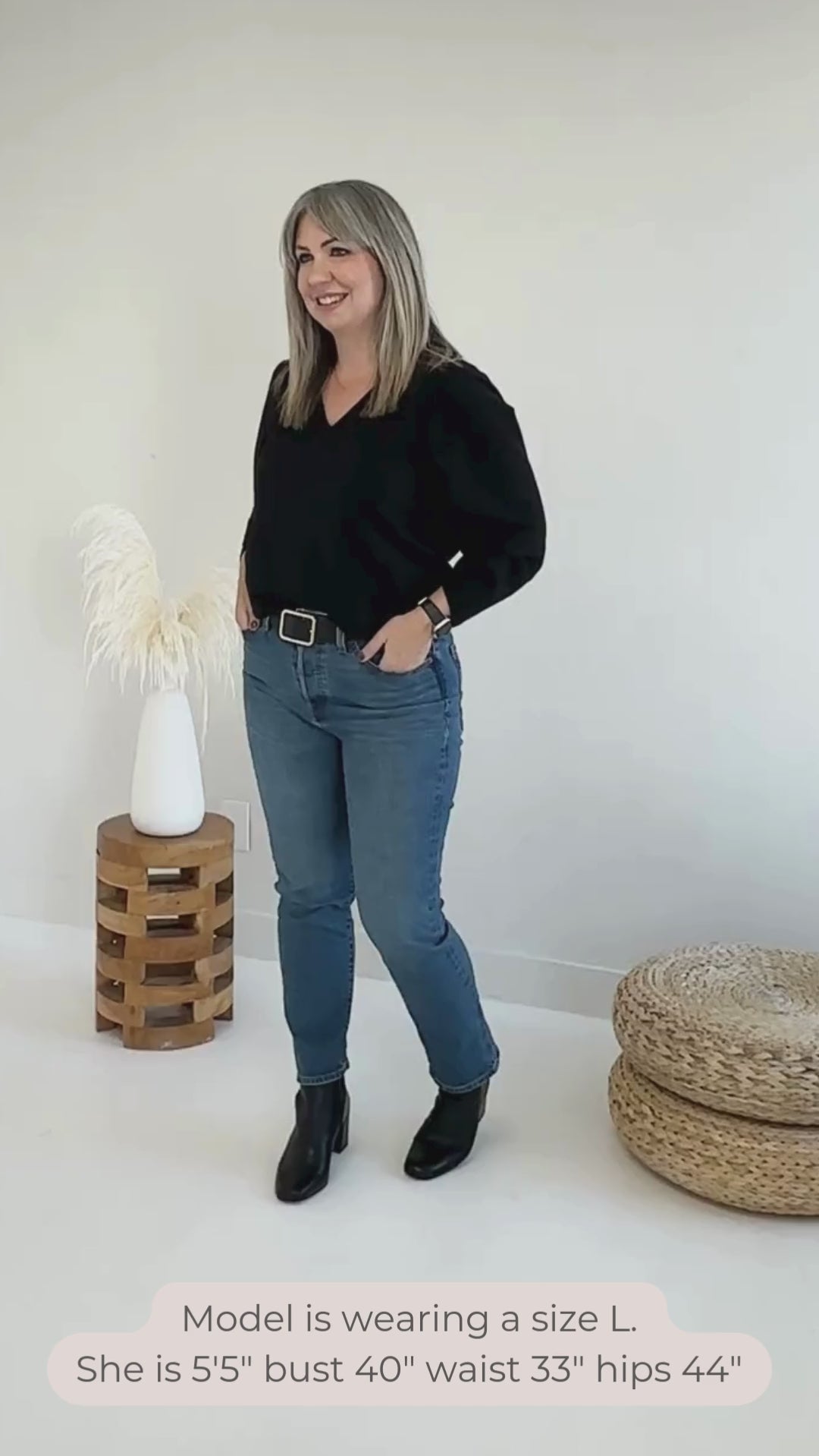 Video of woman wearing a black v-neck sweater. Bamboo clothing made in canada