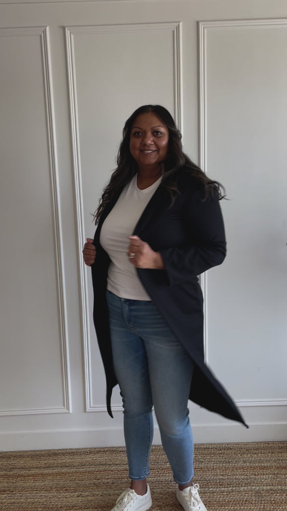 woman wearing white t-shirt and and black long cardigan