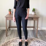 woman standing wearing bamboo tapered black joggers