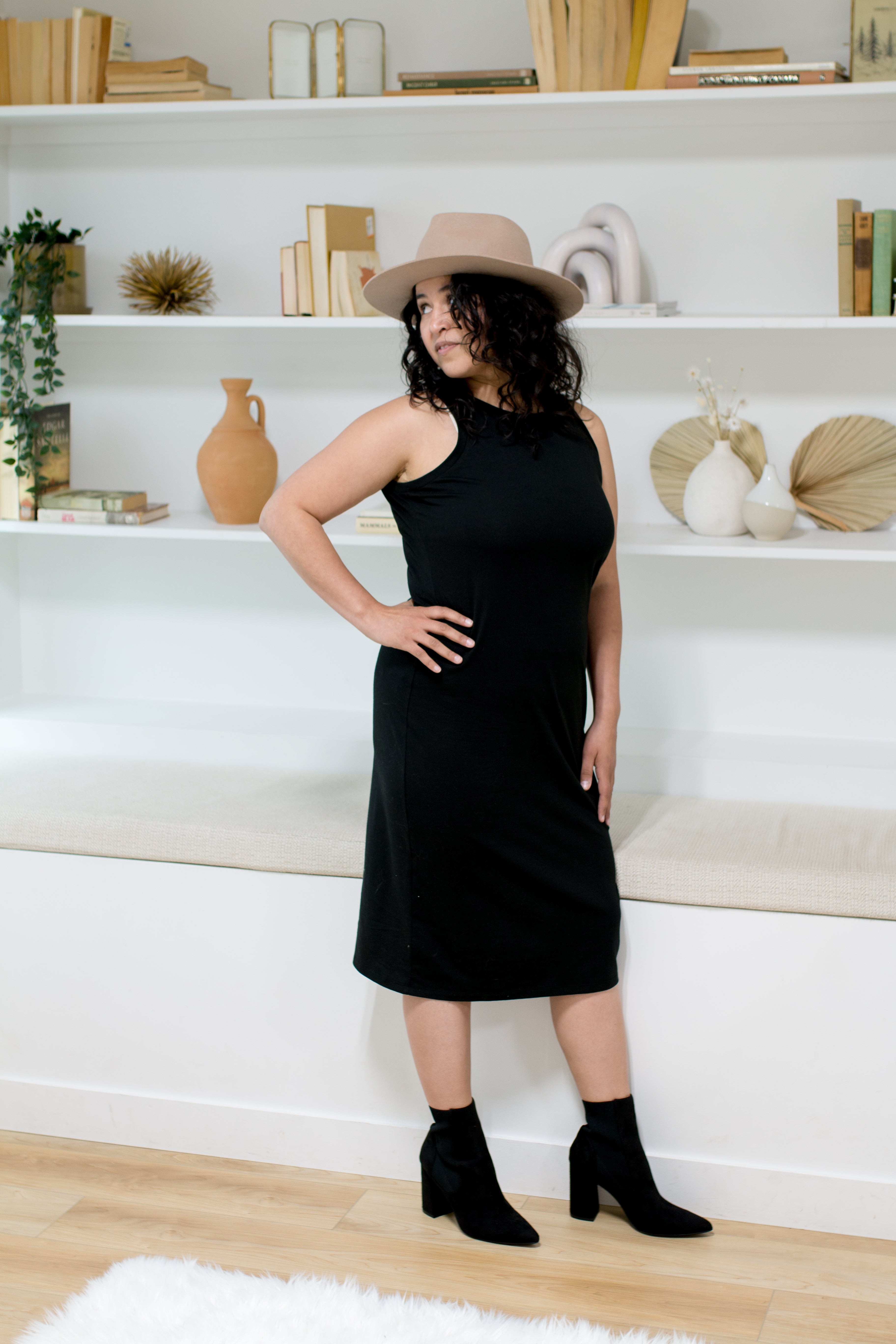woman wearing hat and black midi tank dress and black booties