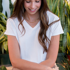 woman wearing a white bamboo v-neck t-shirt for women