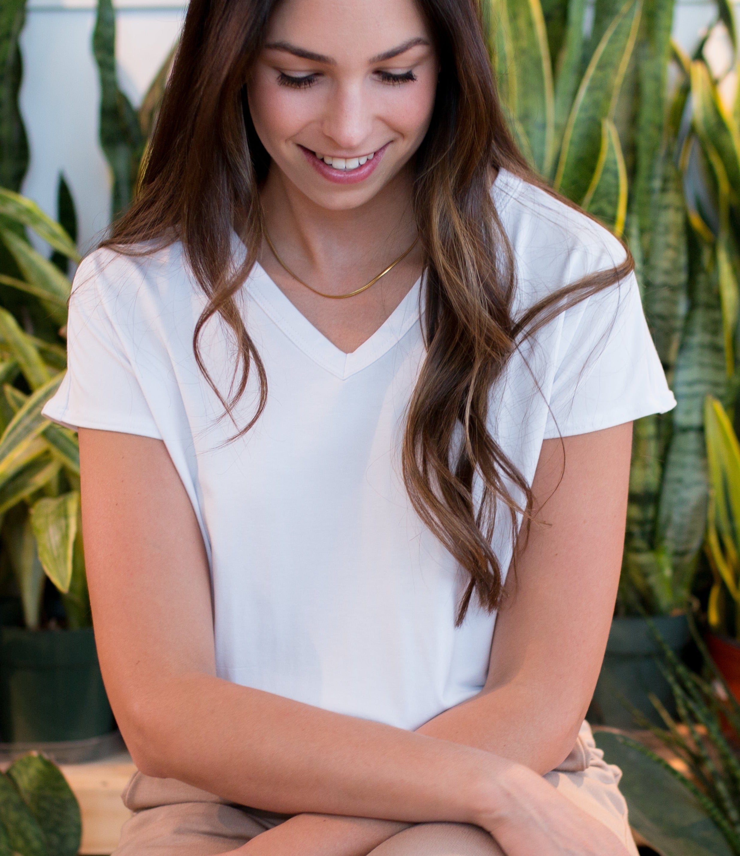 woman wearing a white bamboo v-neck t-shirt for women