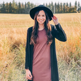 woman wearing black hat, black long cardigan and brown dress 